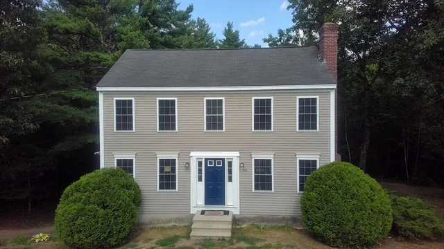 a aerial view of a house with a yard
