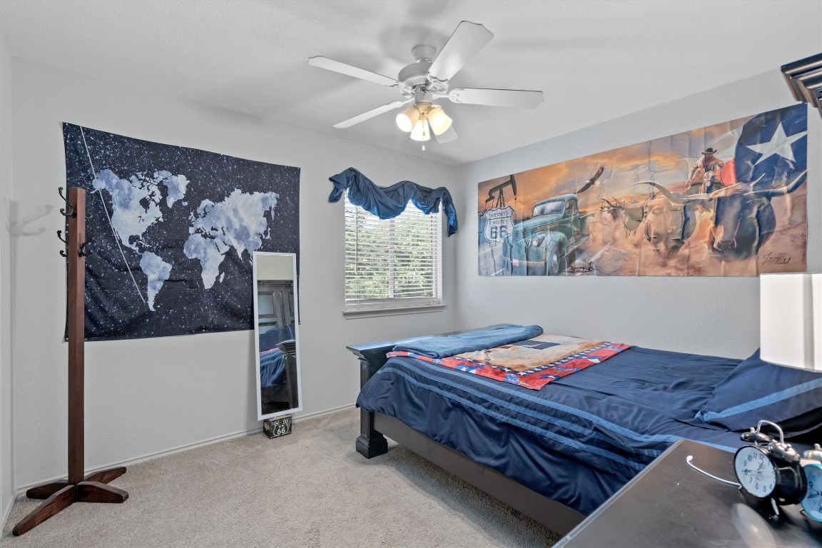 2601 Turtle River Drive Leander, TX 78641 - Photo 19 of 32 a bedroom with a bed and a window