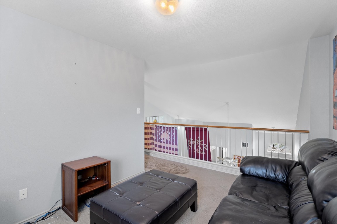 2601 Turtle River Drive Leander, TX 78641 - Photo 23 of 32 a living room with furniture and a couch