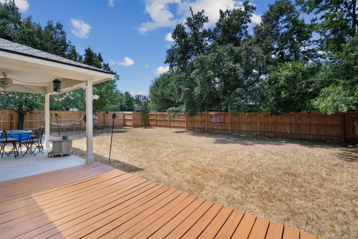 2601 Turtle River Drive Leander, TX 78641 - Photo 27 of 32 a backyard of a house with table and chairs