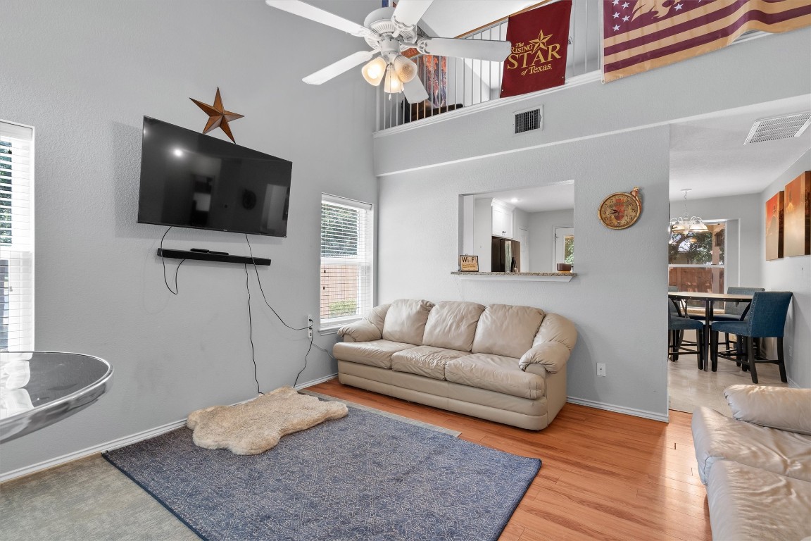 2601 Turtle River Drive Leander, TX 78641 - Photo 6 of 32 a living room with furniture and a flat screen tv