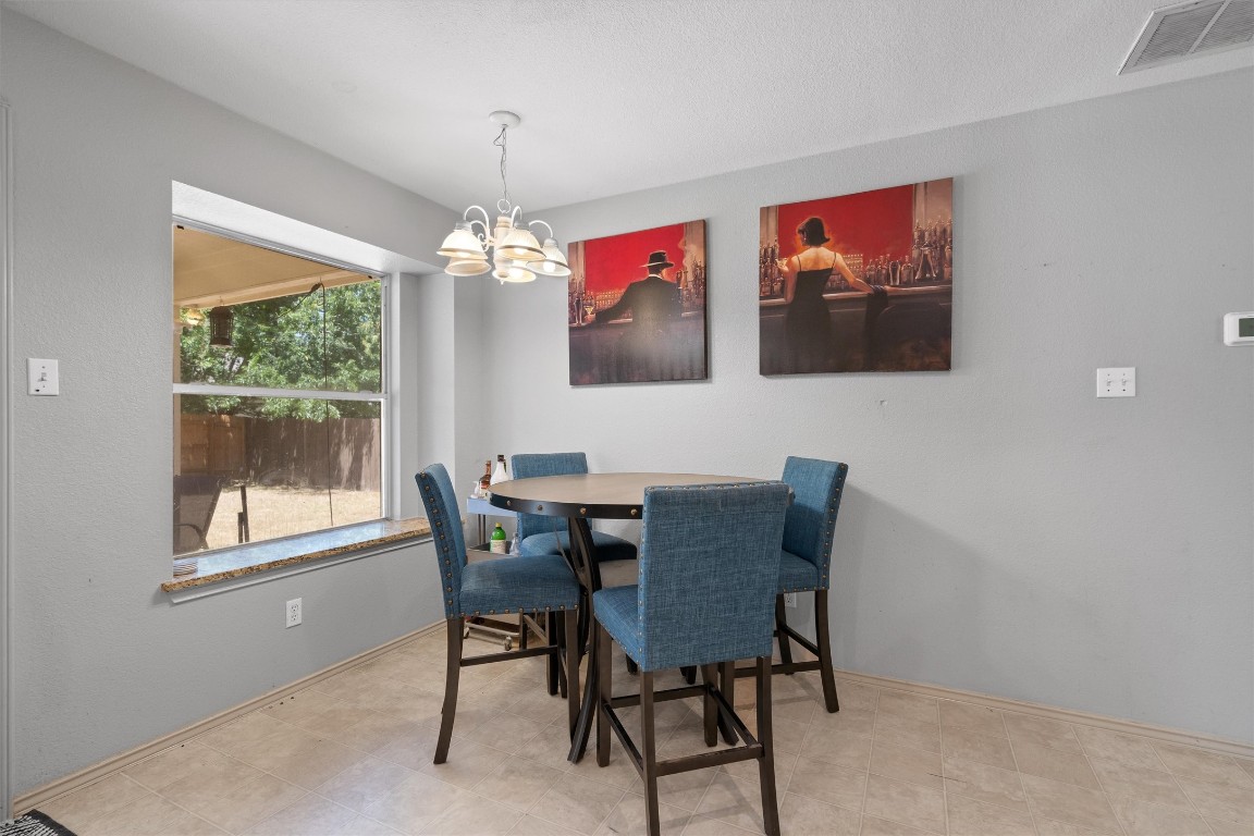 2601 Turtle River Drive Leander, TX 78641 - Photo 10 of 32 a view of a dining room with furniture window and outside view