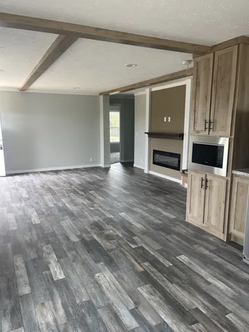 a view of a kitchen with wooden floor