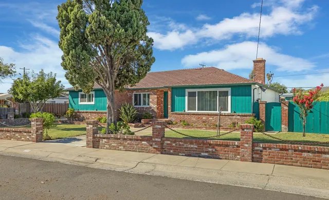 a view of house with outdoor space and porch