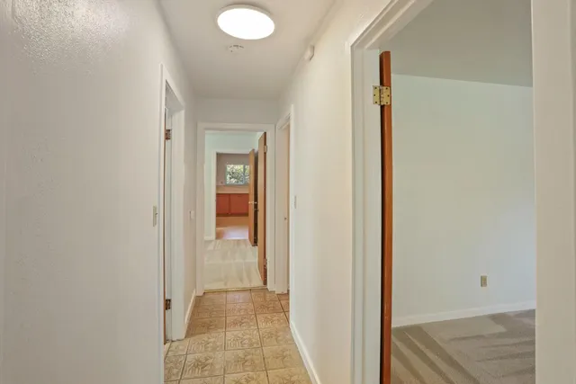 a view of a bathroom from a hallway