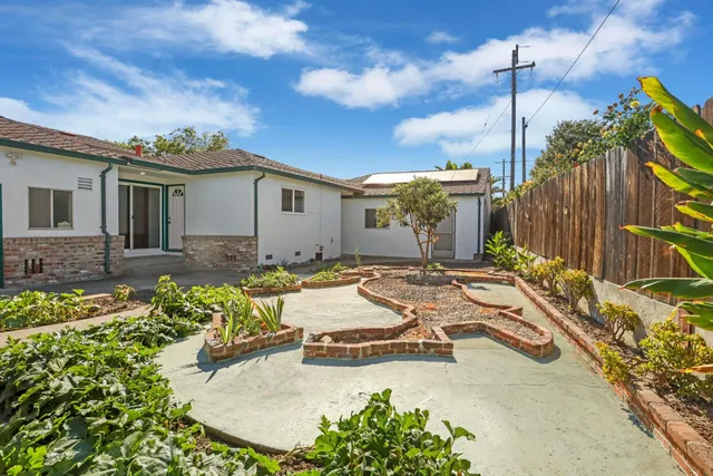a view of a backyard with large trees
