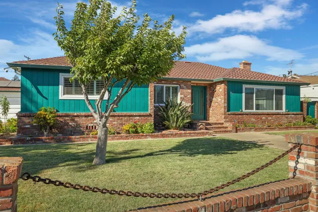 front view of a house with a yard