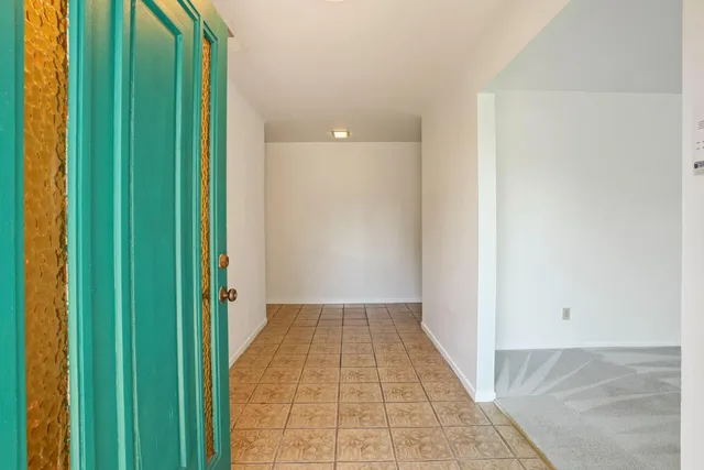 a view of a hallway with a large window