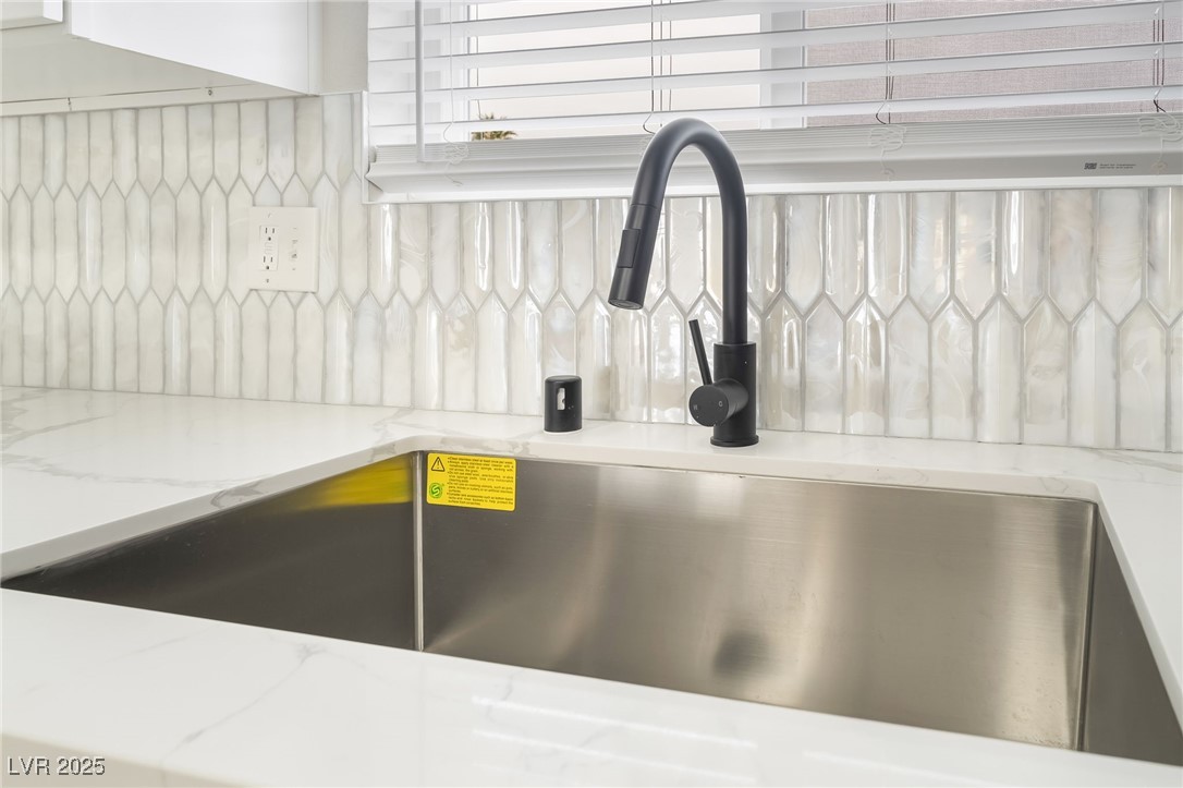 652 Red Lake Way Las Vegas, NV 89110 - Photo 11 of 66 Kitchen view of backsplash and light stone counters