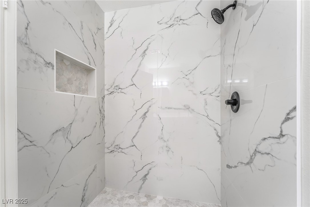 652 Red Lake Way Las Vegas, NV 89110 - Photo 16 of 66 Full bathroom with a marble finish shower