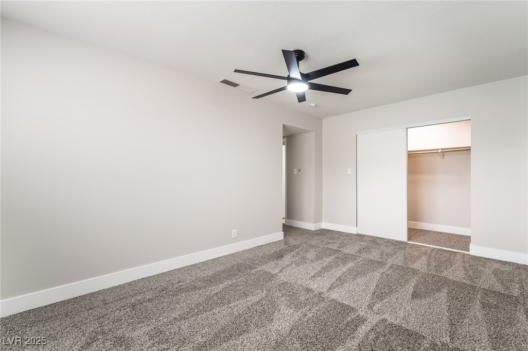 652 Red Lake Way Las Vegas, NV 89110 - Photo 26 of 66 Unfurnished bedroom featuring carpet floors, a ceiling fan, and a closet