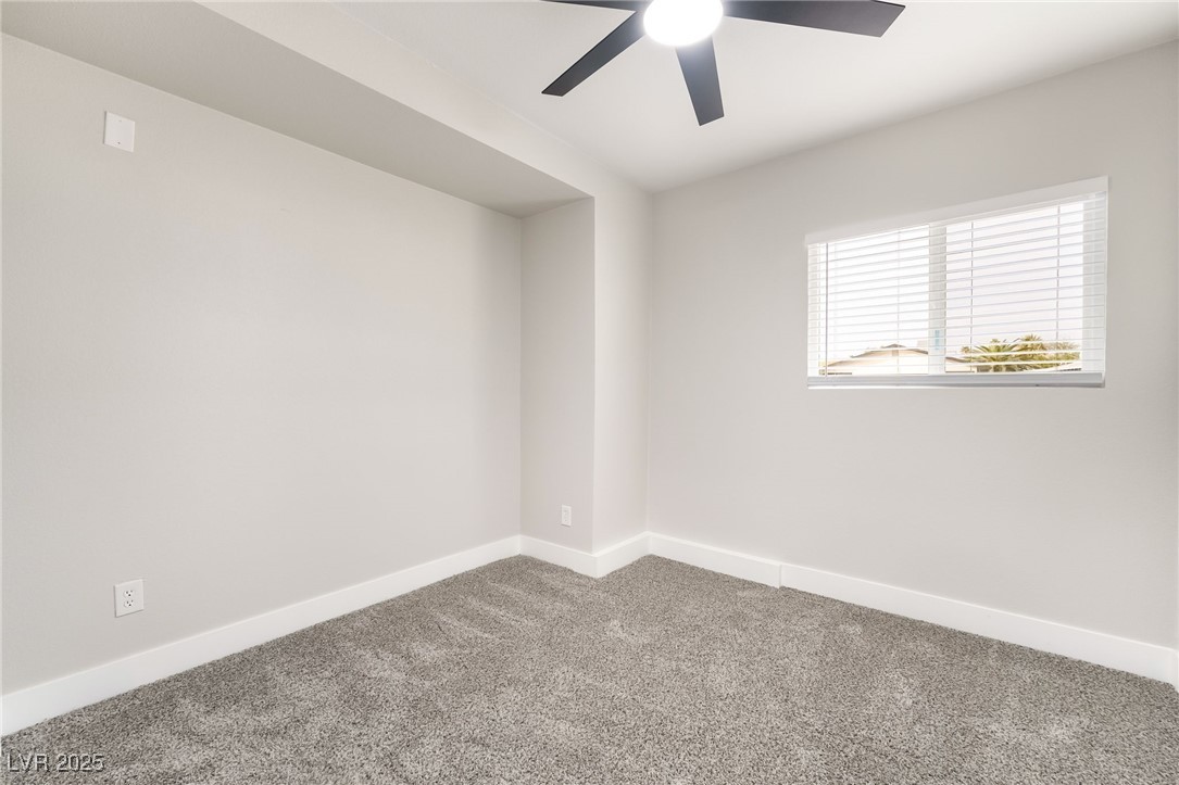652 Red Lake Way Las Vegas, NV 89110 - Photo 39 of 66 Carpeted empty room with baseboards and ceiling fan