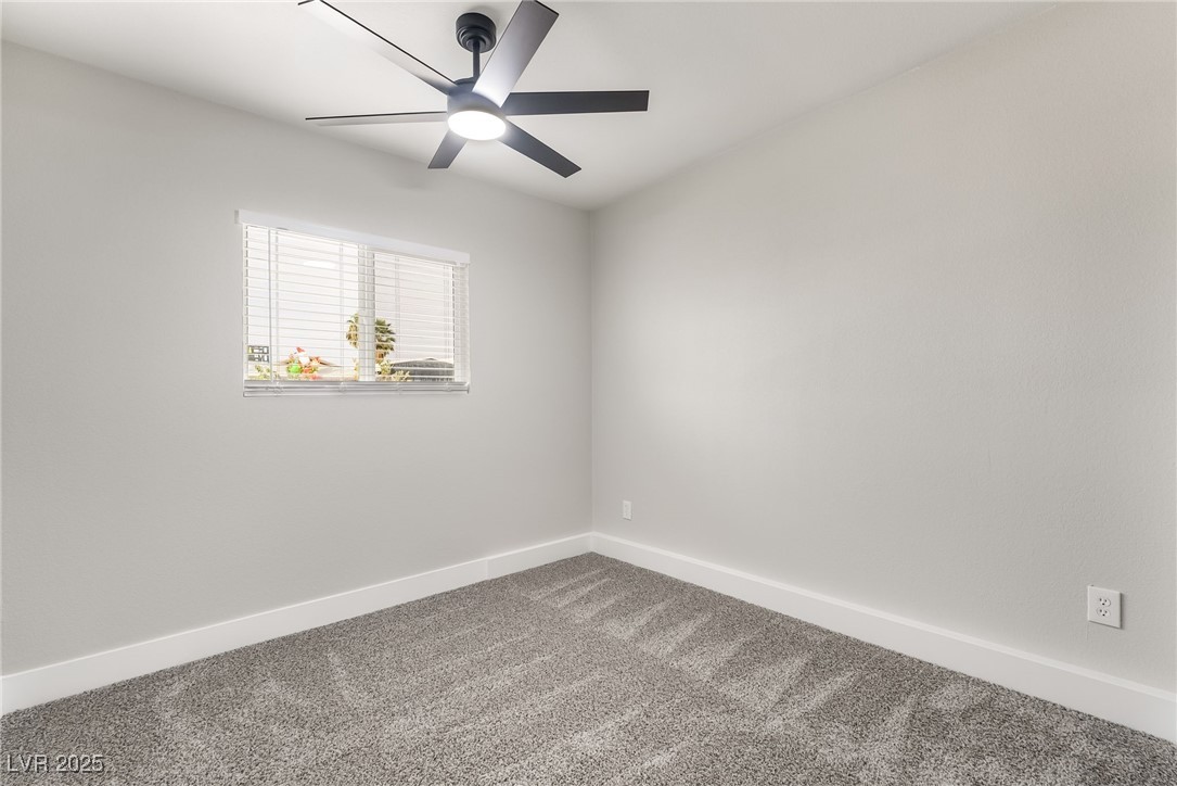652 Red Lake Way Las Vegas, NV 89110 - Photo 41 of 66 Carpeted empty room with baseboards and a ceiling fan