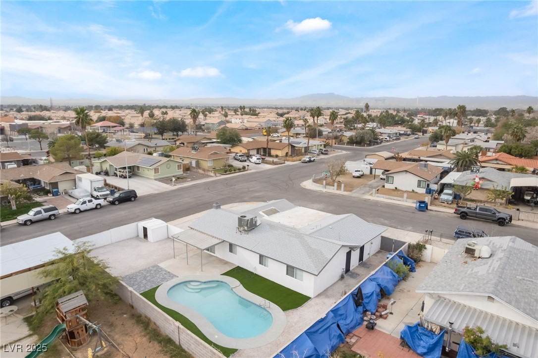 652 Red Lake Way Las Vegas, NV 89110 - Photo 52 of 66 Aerial view of residential area featuring a pool and mountains