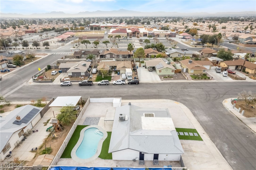 652 Red Lake Way Las Vegas, NV 89110 - Photo 55 of 66 Aerial view of residential area featuring a mountain backdrop and a pool