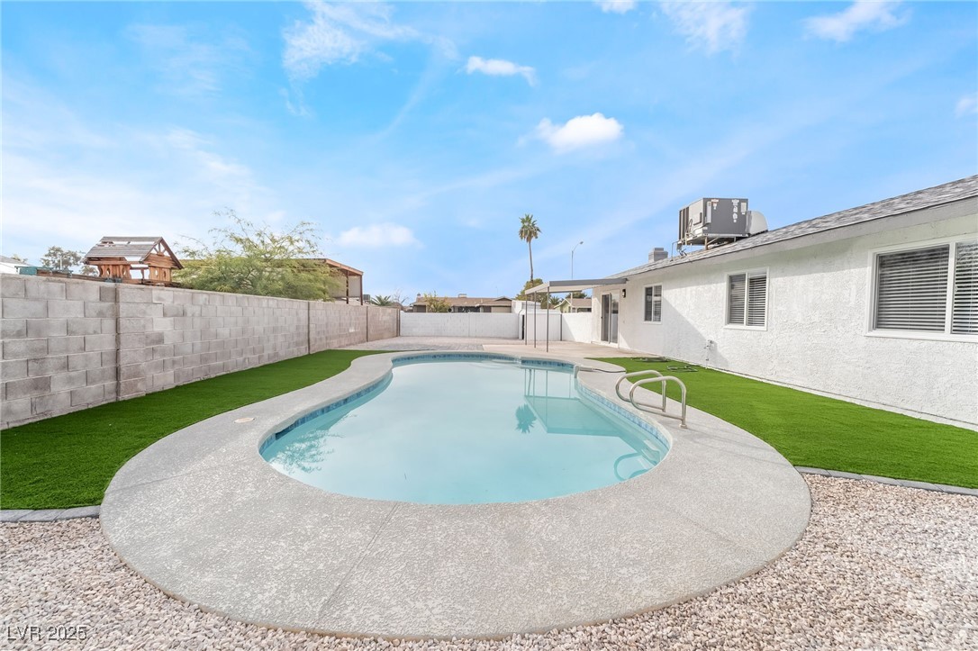652 Red Lake Way Las Vegas, NV 89110 - Photo 6 of 66 View of pool featuring a patio area and a fenced backyard