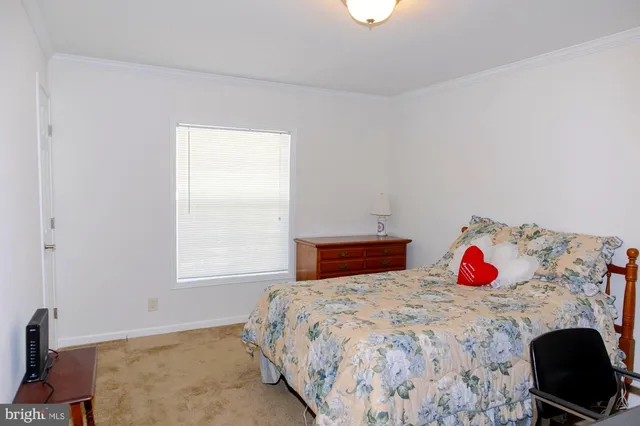 a bedroom with a bed and dresser