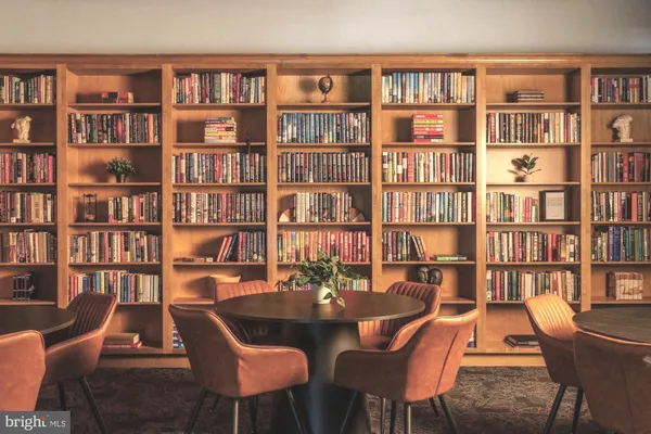a room with lots of furniture and windows