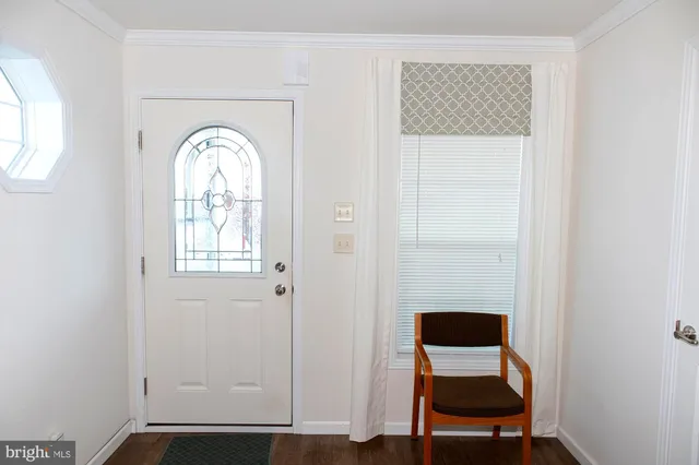 a view of entryway with a small yard and chair