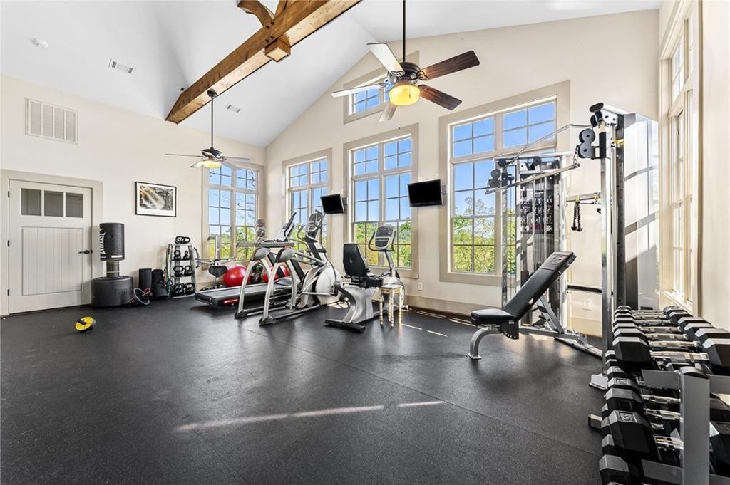 0 Gabriel Way Pickens, SC 29671 - Photo 6 of 14 This spacious gym features exposed beams and abundant natural light, creating an inviting workout environment.
