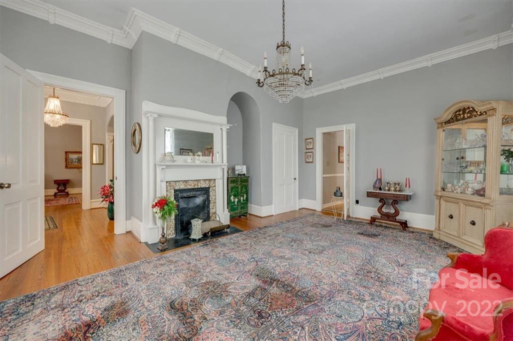 204 West South Street Union, SC 29379 - Photo 13 of 38 a view of a livingroom with wooden floor and a fireplace
