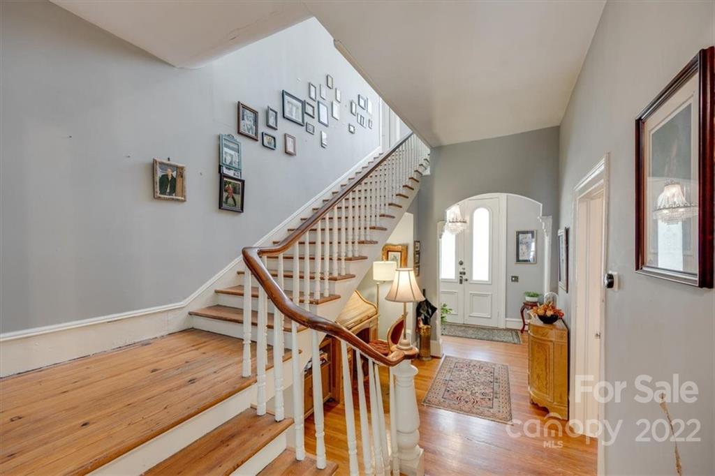 204 West South Street Union, SC 29379 - Photo 19 of 38 a view of a hallway with wooden floor staircase and livingroom view