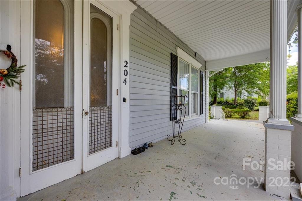 204 West South Street Union, SC 29379 - Photo 2 of 38 a backyard of a house with barbeque oven table and chairs