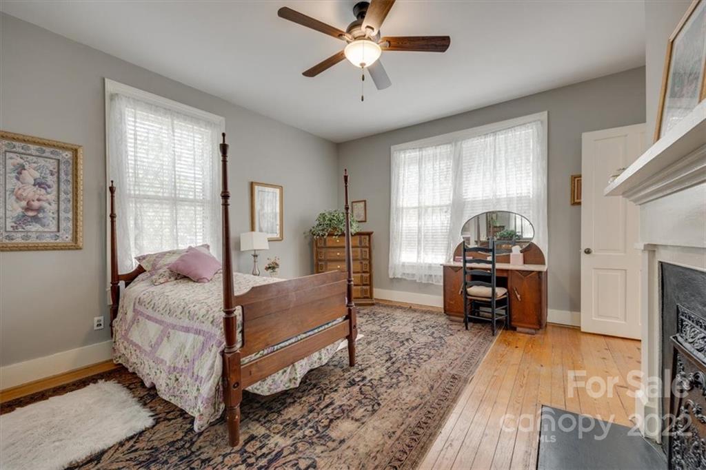 204 West South Street Union, SC 29379 - Photo 22 of 38 a bedroom with a bed and wooden floor