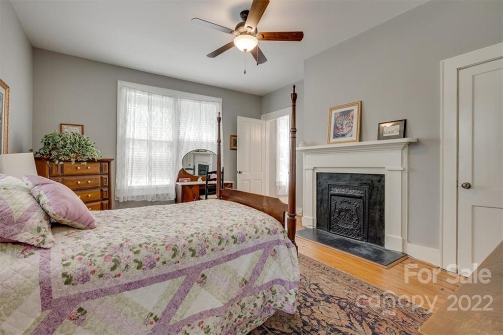 204 West South Street Union, SC 29379 - Photo 23 of 38 a bedroom with a bed and a fireplace