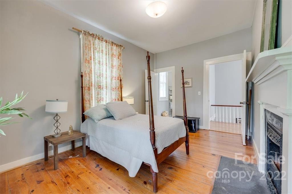 204 West South Street Union, SC 29379 - Photo 29 of 38 a bedroom with a bed a table and painting on the wall