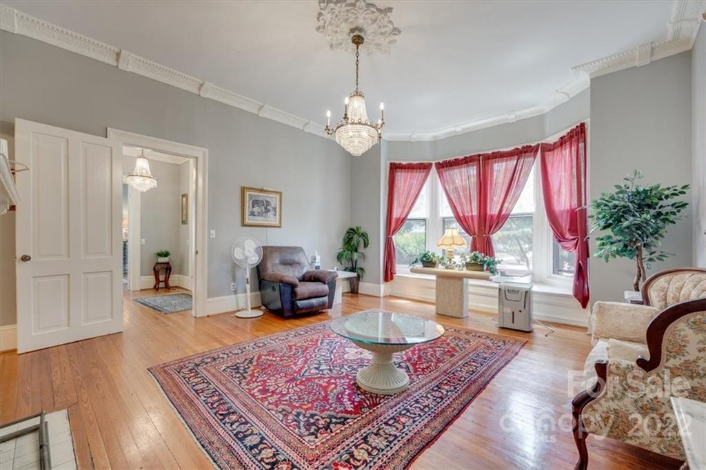 204 West South Street Union, SC 29379 - Photo 6 of 38 a living room with furniture large window and wooden floor
