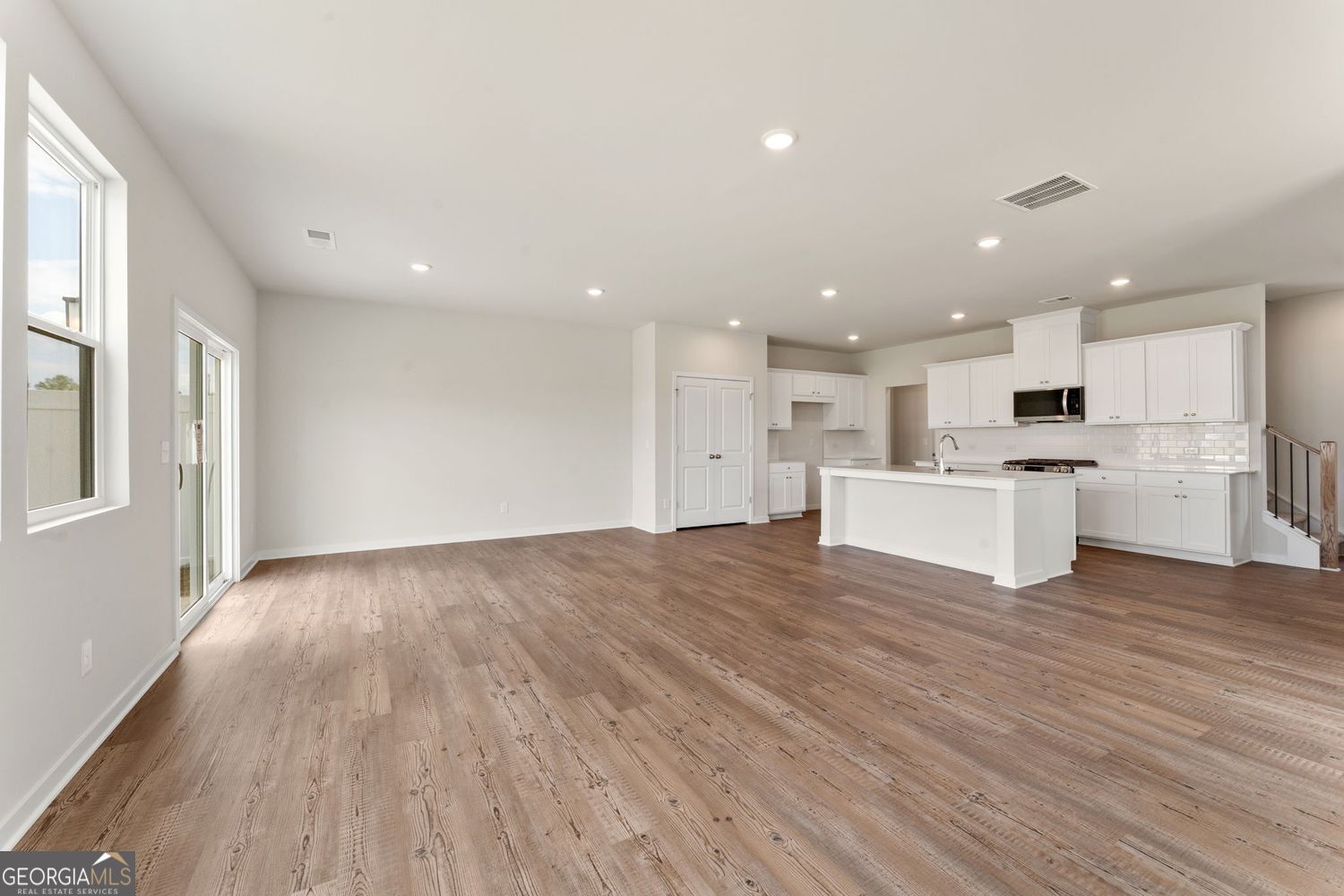 1299 Farmers Loop Austell, GA 30106 - Photo 13 of 23 a view of kitchen with wooden floor and electronic appliances