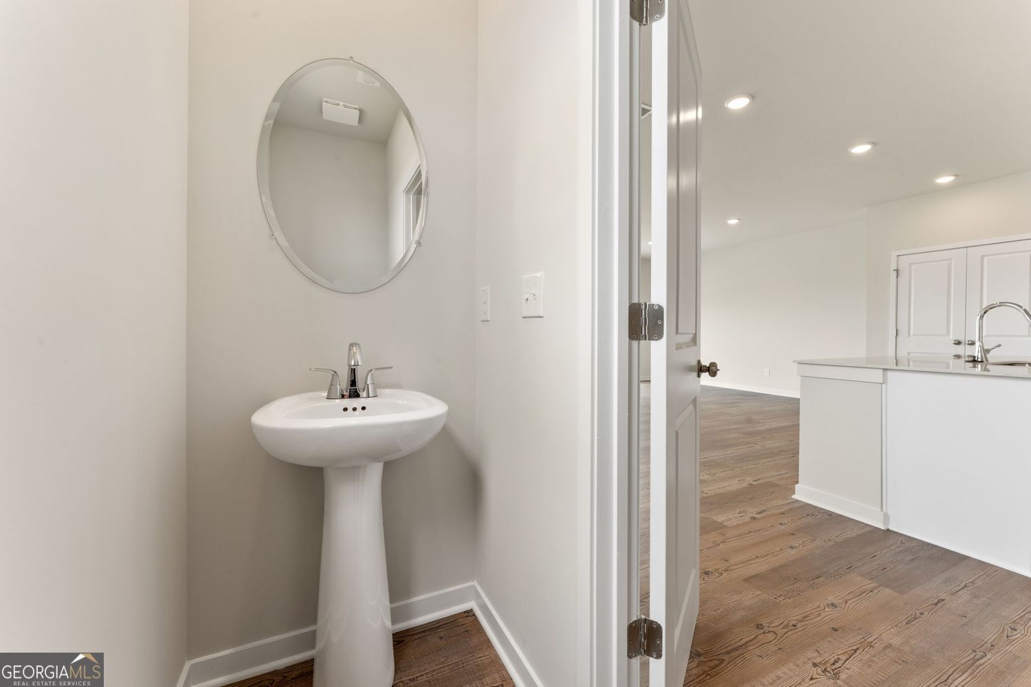 1299 Farmers Loop Austell, GA 30106 - Photo 14 of 23 a bathroom with a sink a mirror and a shower