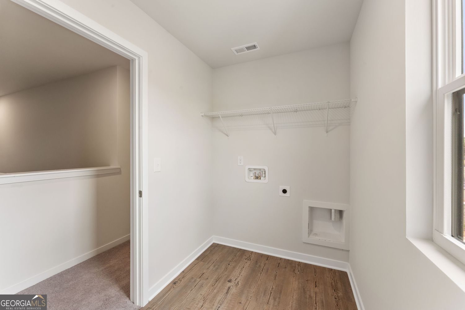1299 Farmers Loop Austell, GA 30106 - Photo 19 of 23 a view of a room with wooden floor