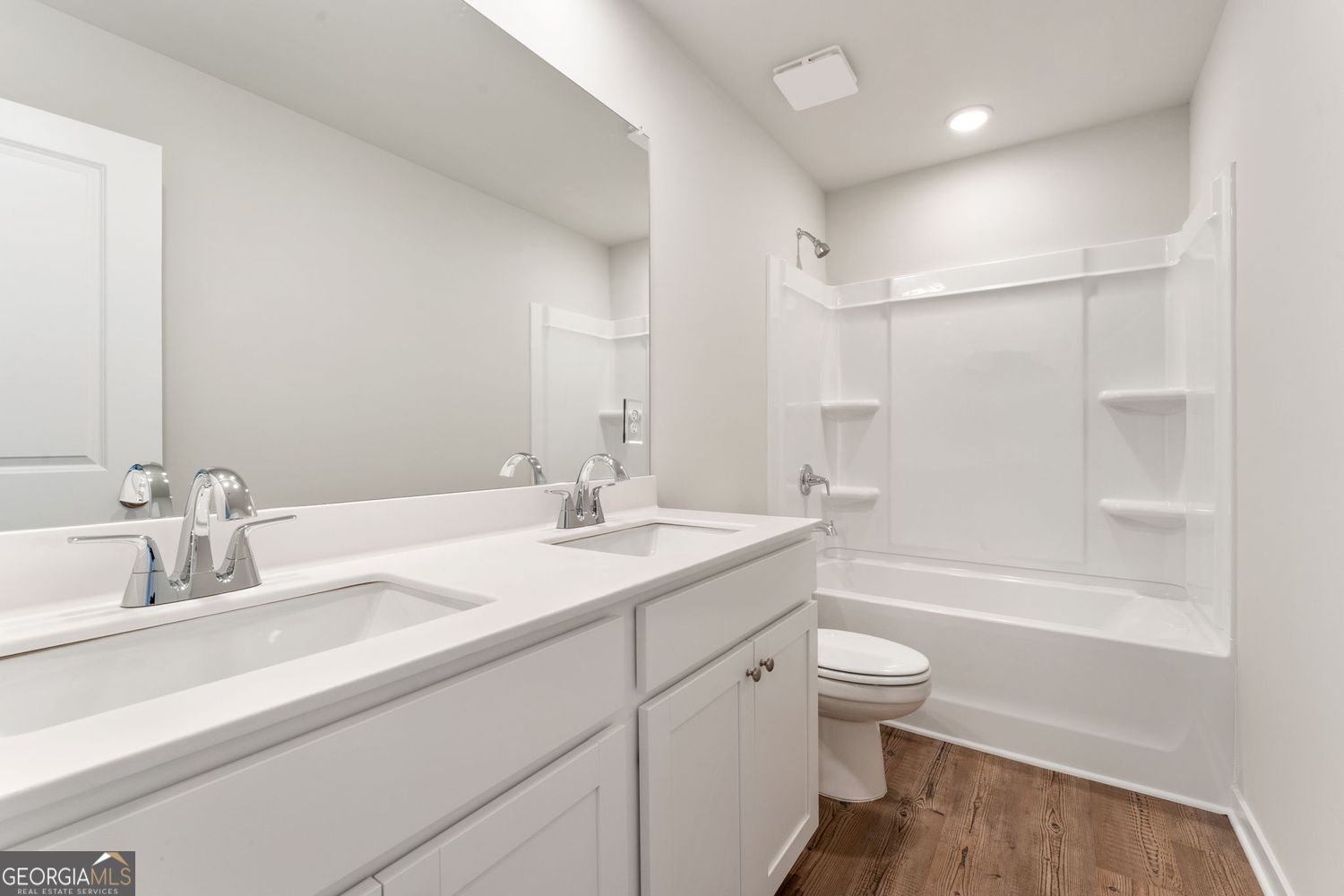 1299 Farmers Loop Austell, GA 30106 - Photo 22 of 23 a bathroom with a sink a toilet and shower