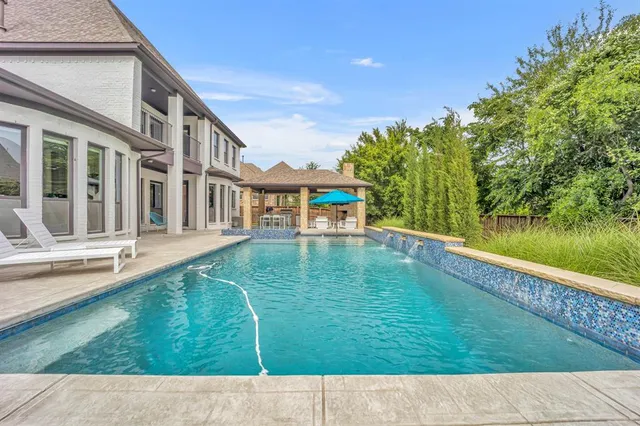 a view of swimming pool with a garden