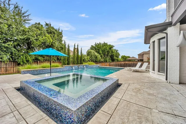a view of a backyard with a patio