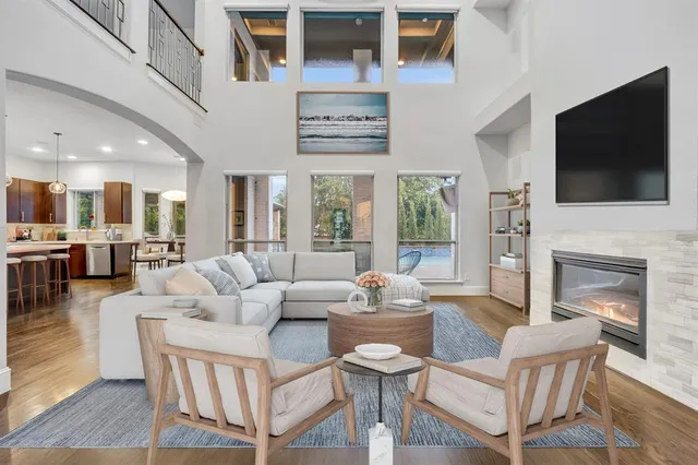 a living room with fireplace furniture and a flat screen tv