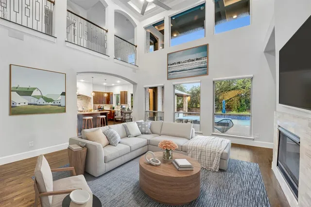 a living room with furniture fireplace and a flat screen tv