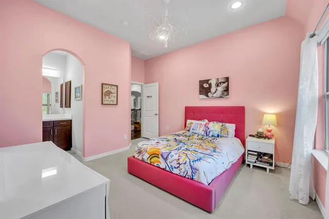 a bedroom with a bed and a table