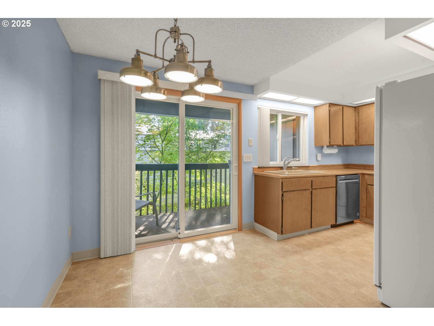 650 Southwest Meadow Drive, Unit 218 Beaverton, OR 97006 - Photo 11 of 25 a kitchen with a sink and a large window