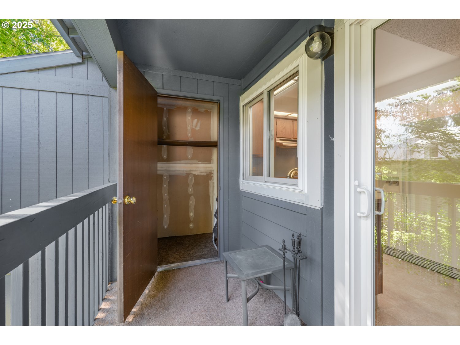 650 Southwest Meadow Drive, Unit 218 Beaverton, OR 97006 - Photo 15 of 25 a view of a hallway with a door and wooden floor