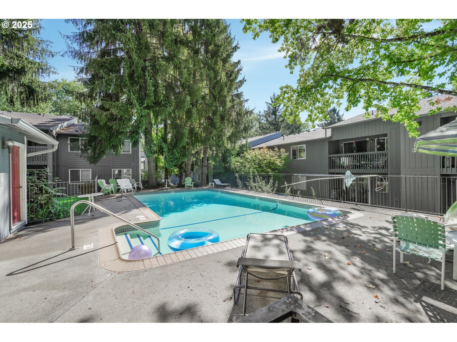 650 Southwest Meadow Drive, Unit 218 Beaverton, OR 97006 - Photo 2 of 25 a view of a backyard with wooden fence
