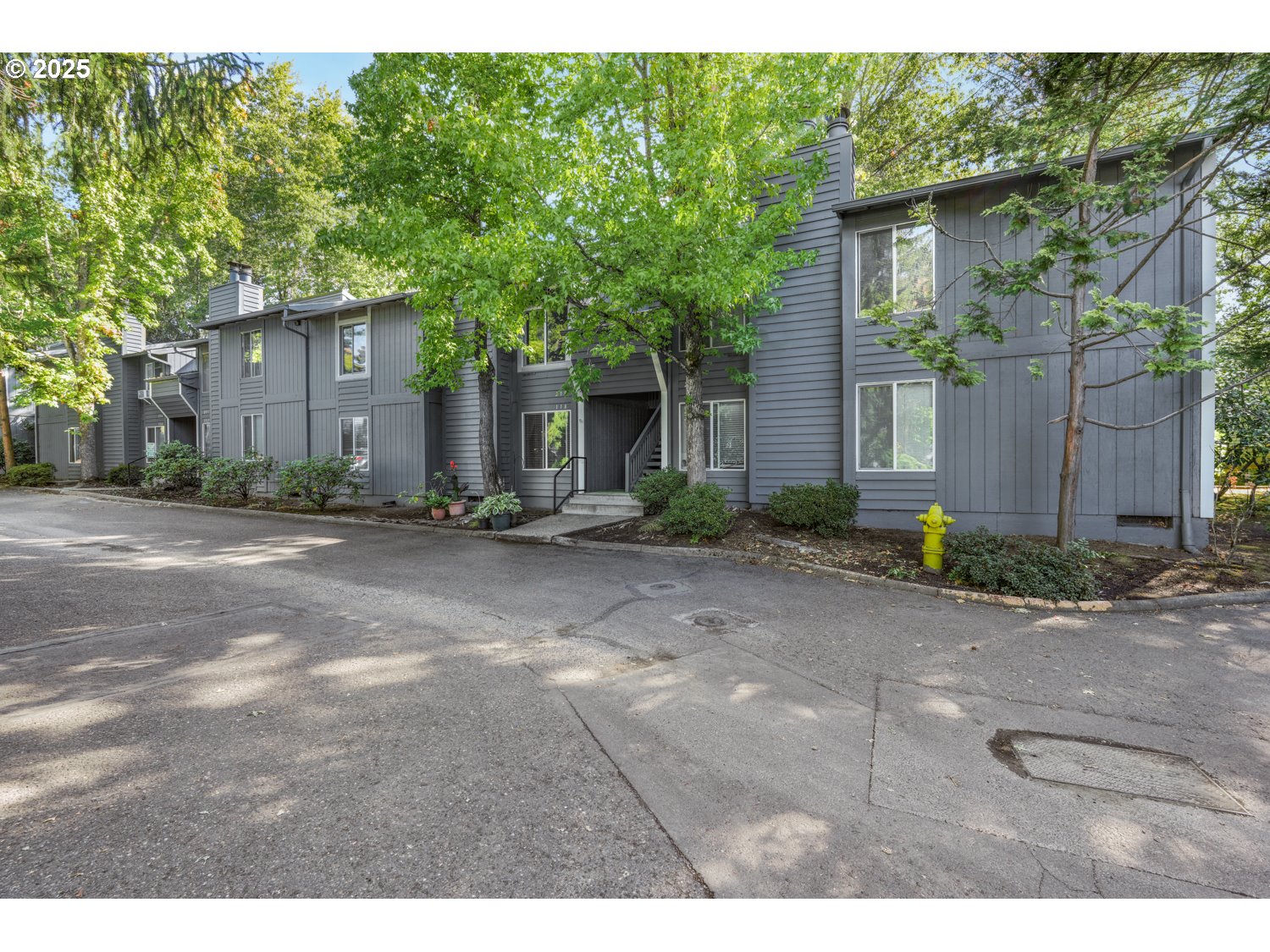 650 Southwest Meadow Drive, Unit 218 Beaverton, OR 97006 - Photo 24 of 25 a front view of a house with garden