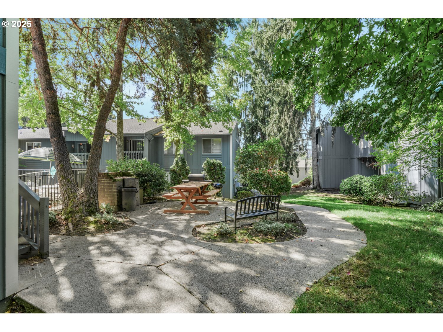 650 Southwest Meadow Drive, Unit 218 Beaverton, OR 97006 - Photo 3 of 25 a view of a house with backyard sitting area and garden