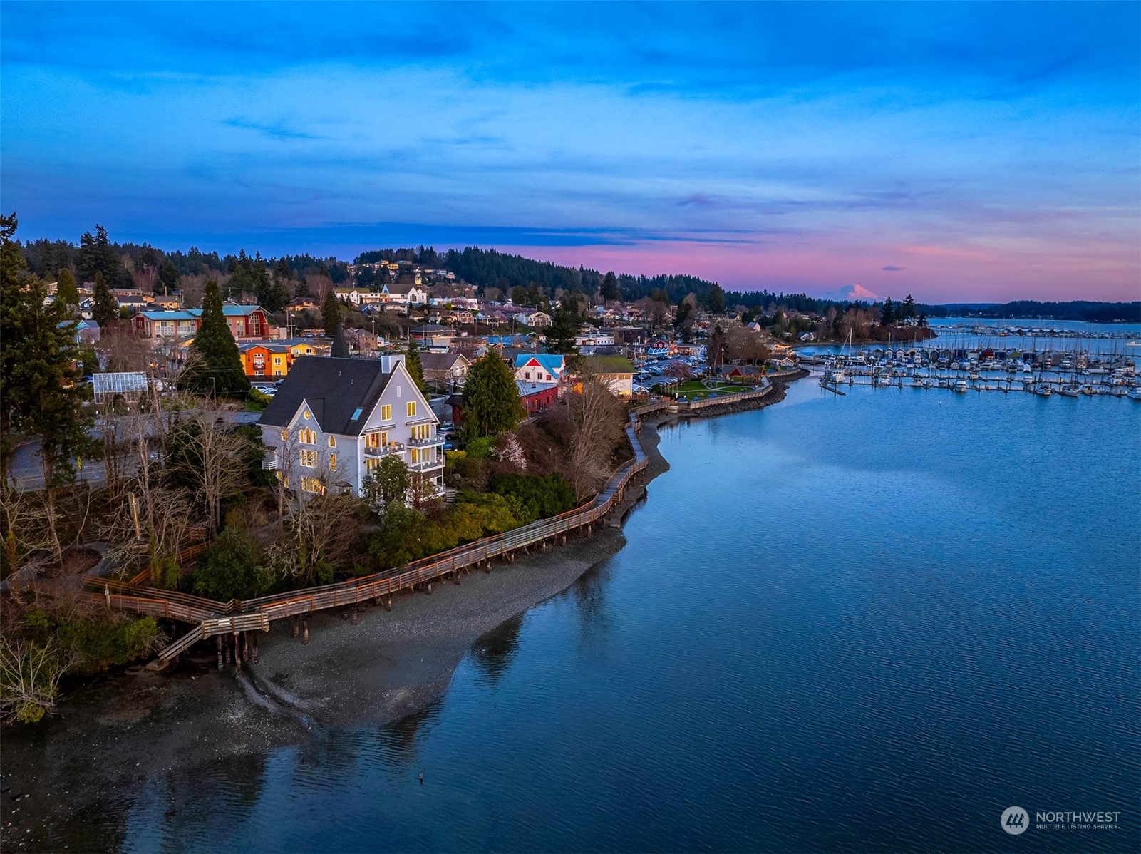 19083 Front Street Northeast, Unit 4 Poulsbo, WA 98370 - Photo 1 of 40 a view of a city with ocean view