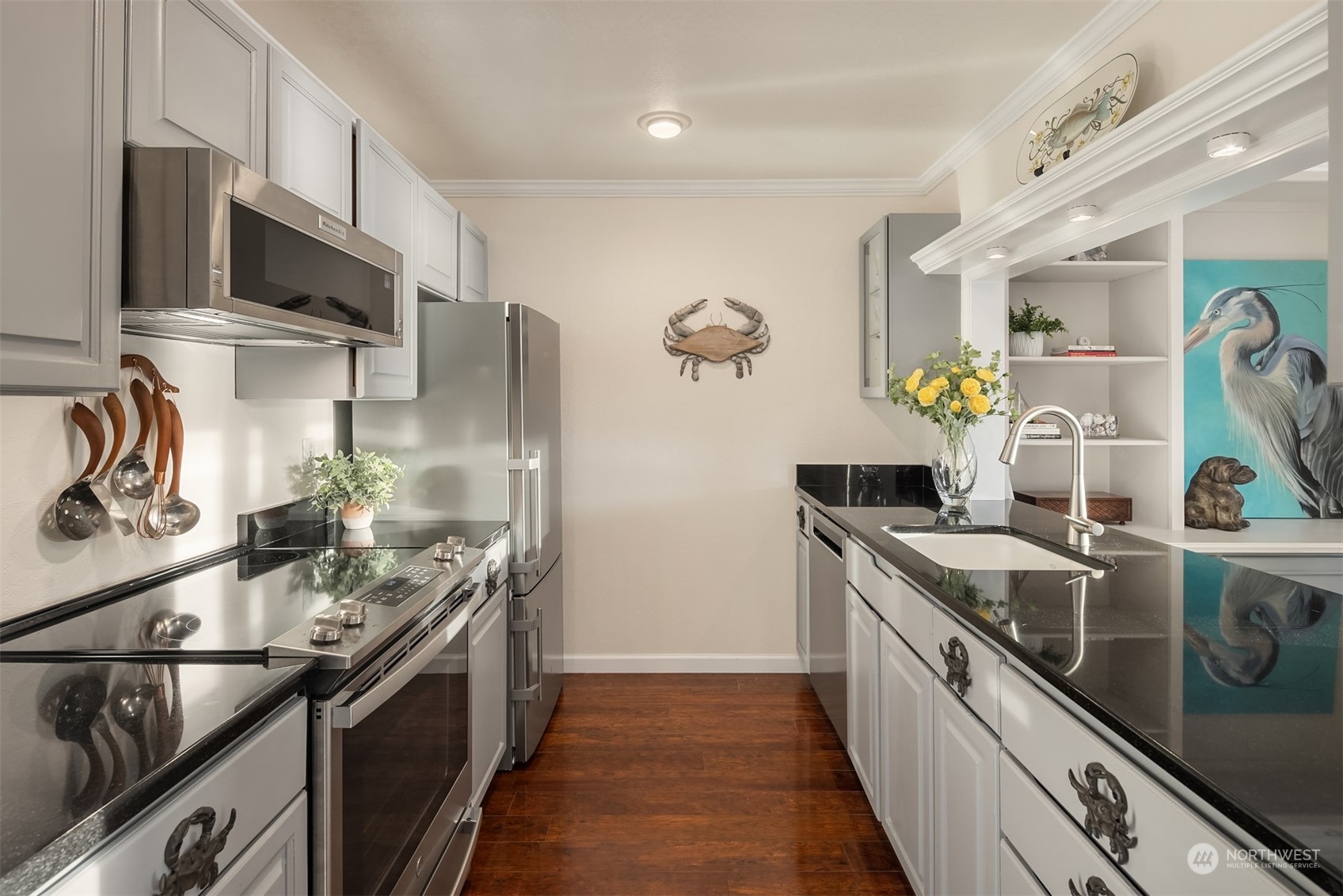 19083 Front Street Northeast, Unit 4 Poulsbo, WA 98370 - Photo 14 of 40 a kitchen with stainless steel appliances granite countertop a sink stove and refrigerator