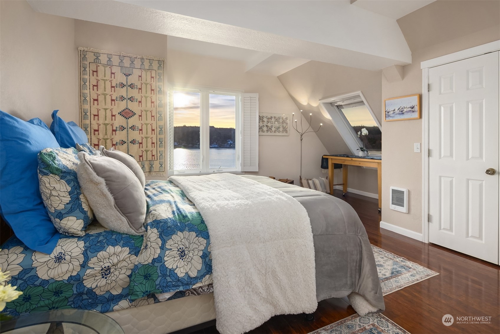 19083 Front Street Northeast, Unit 4 Poulsbo, WA 98370 - Photo 17 of 40 a spacious bedroom with a bed dresser and a window