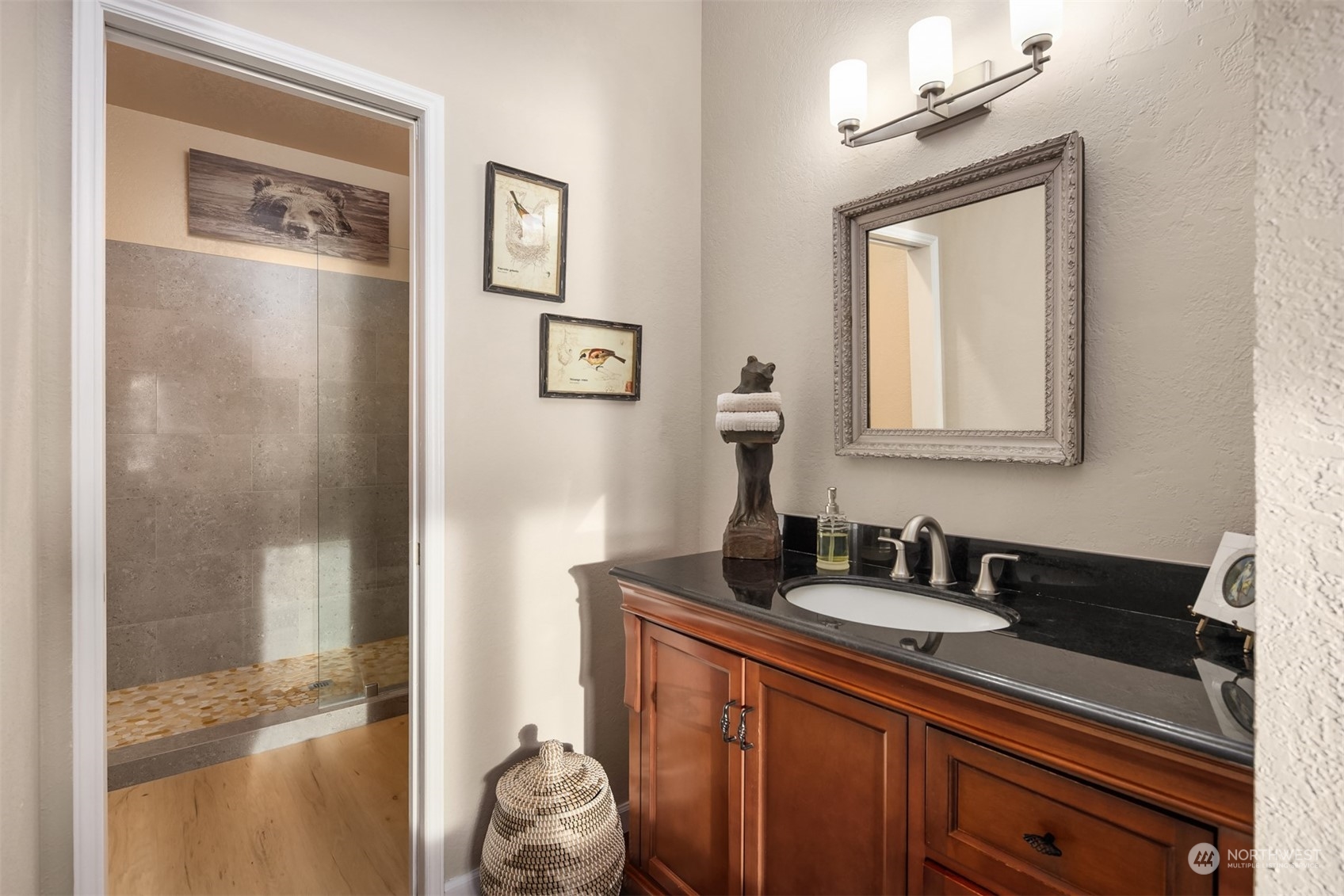 19083 Front Street Northeast, Unit 4 Poulsbo, WA 98370 - Photo 19 of 40 a bathroom with a sink and a mirror