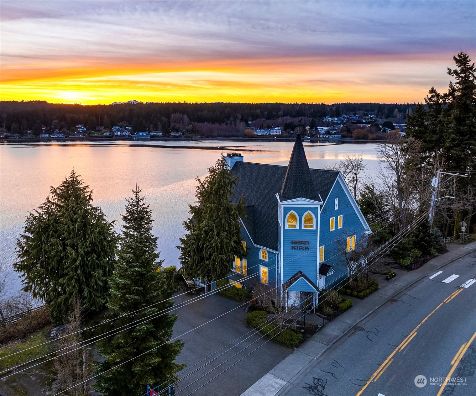 19083 Front Street Northeast, Unit 4 Poulsbo, WA 98370 - Photo 2 of 40 a view of swimming pool and lake from a outdoor space